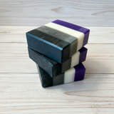 Stack of ace flag soap bars on a wooden surface