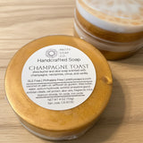 Handcrafted soap with a label on a wooden surface