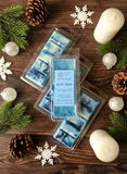 Packaged soap bars with 'Arctic Shore' label on a wooden surface