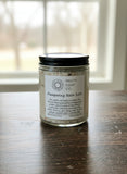 Jar of 'Pampering Bath Salts' from Pretty Soap Co on a wooden surface