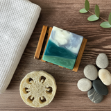 Handcrafted soap with a layered design on a wooden block