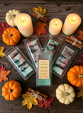 Packaged wax melts with a 'Fall Color' label on a wooden surface