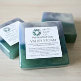 Handcrafted soap with a label on a wooden surface