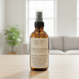 Vanilla Dreams spray bottle from Pretty Soap Co. on a wooden surface